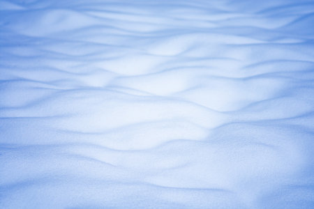 Winter white background. Background of fresh snow. Abstract bright snowy backgroundの写真素材