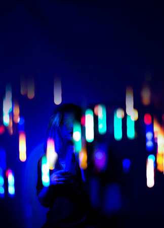 Young manicurist professional wearing VR glasses experiencing a new virtual world. Portrait of a beauty industry professional with virtual reality glasses.の写真素材