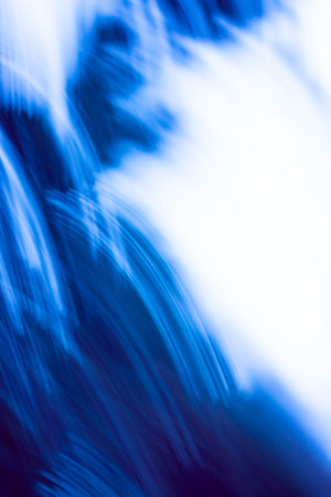 The blurred composition suggests hidden movement and suspense, perfect as a defocused background or abstract blurry backplate.の写真素材