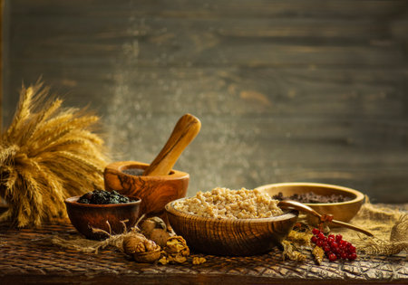 Cultural cuisine concept captured in warm rustic style. Sweet Ukrainian Christmas kutya with festive ingredients.の写真素材