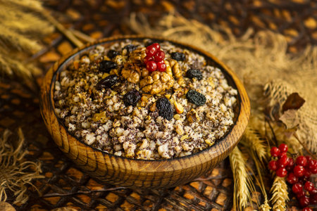 Traditional Ukrainian food. Traditional Christmas kutya on the table. Sweet Christmas dish in rustic clay bowl.の写真素材