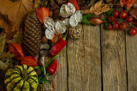 Various autumn harvest elements surround rustic wooden planks. Warm tones emphasize organic fall...