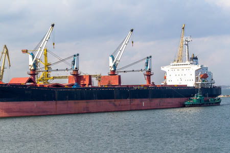 ODESSA, UKRAINE - APRIL 15: maritime cargo ship moored in the harbor of Odessa sea port . Loading...