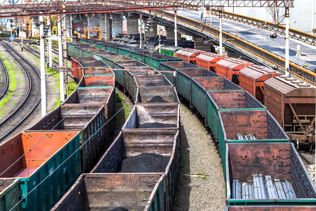 Coal , metal, iron square tube is transported in railway train marshalling yardのeditorial素材