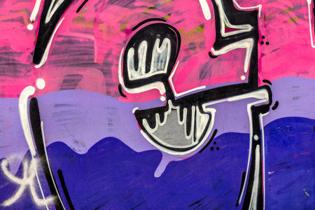 Beautiful street art graffiti. Abstract creative drawing fashion colors on the walls of the city. Urban Contemporary Cultureの写真素材