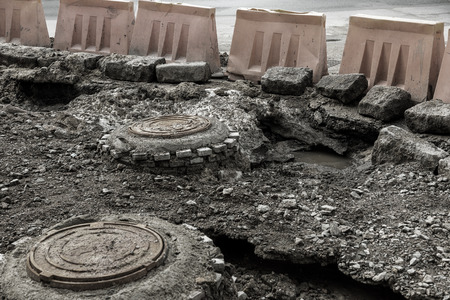 Aftermath of flood and heavy frosts and heavy snow. Flood after winter, water washed away pieces of...