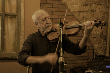 ODESSA, UKRAINE - October 15, 2018: Muskakanty jazz groups play old gangster traditional jazz-blues song in the famous Gambrinus tavern in the basement of the catacombs on Deribasovskaya in Odessaのeditorial素材