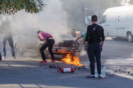 ODESSA, UKRAINE - Oct. 13 2018: Burning car in middle of highway. Sudden Fire from short circuit...