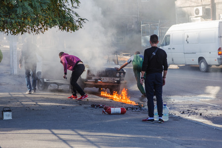 ODESSA, UKRAINE - Oct. 13 2018: Burning car in middle of highway. Sudden Fire from short circuit...