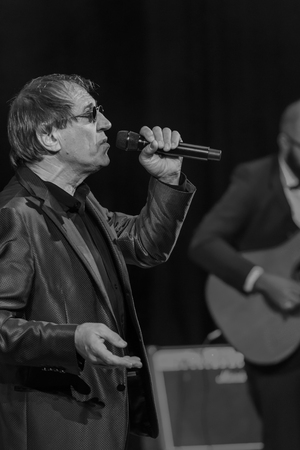ODESSA, UKRAINE - Nov. 4, 2018: concert performance by Adriano Celentano. Soloist of the music group - Adolfo Sebastiani - famous singer, showman Celentano. Tribute Show Celentano. Italian pop legendのeditorial素材