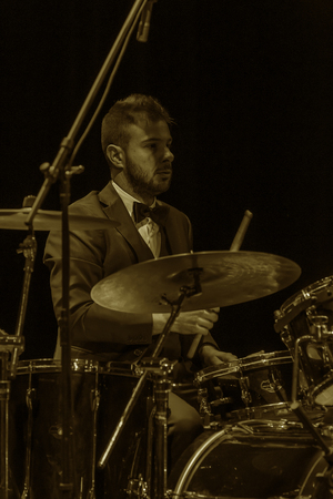 Odessa, Ukraine - November 4, 2018: Musical ensemble, jazz bands of team tribute to show Celentano on stage during creative light and musical show. Cheerful bright show in party clubのeditorial素材