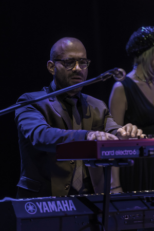 Odessa, Ukraine - November 4, 2018: Musical ensemble, jazz bands of team tribute to show Celentano on stage during creative light and musical show. Cheerful bright show in party clubのeditorial素材