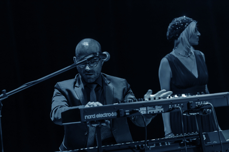 Odessa, Ukraine - November 4, 2018: Musical ensemble, jazz bands of team tribute to show Celentano on stage during creative light and musical show. Cheerful bright show in party clubのeditorial素材