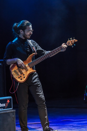 Odessa, Ukraine - November 4, 2018: Musical ensemble, jazz bands of team tribute to show Celentano on stage during creative light and musical show. Cheerful bright show in party clubのeditorial素材