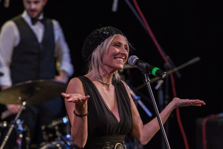 Odessa, Ukraine - November 4, 2018: Musical ensemble, jazz bands of team tribute to show Celentano on stage during creative light and musical show. Cheerful bright show in party clubのeditorial素材