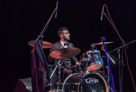 Odessa, Ukraine - November 4, 2018: Musical ensemble, jazz bands of team tribute to show Celentano on stage during creative light and musical show. Cheerful bright show in party clubのeditorial素材