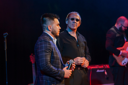 ODESSA, UKRAINE - Nov. 4, 2018: concert performance by Adriano Celentano. Soloist of the music group - Adolfo Sebastiani - famous singer, showman Celentano. Tribute Show Celentano. Italian pop legendのeditorial素材