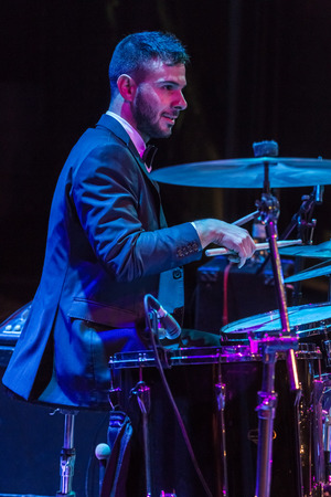 Odessa, Ukraine - November 4, 2018: Musical ensemble, jazz bands of team tribute to show Celentano on stage during creative light and musical show. Cheerful bright show in party clubのeditorial素材