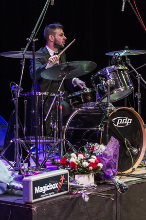 Odessa, Ukraine - November 4, 2018: Musical ensemble, jazz bands of team tribute to show Celentano on stage during creative light and musical show. Cheerful bright show in party clubのeditorial素材