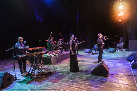 Odessa, Ukraine - November 4, 2018: Musical ensemble, jazz bands of team tribute to show Celentano on stage during creative light and musical show. Cheerful bright show in party clubのeditorial素材