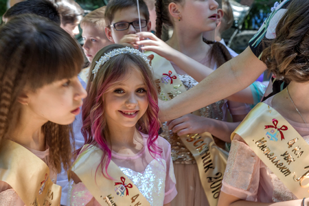 Odessa, Ukraine - May 31,2018: Children's musical group sing and dance on stage during graduation concert of elementary school. Children play. Emotional children's show on stage. Children's creativityのeditorial素材