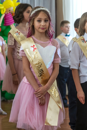 Odessa, Ukraine - May 31,2018: Children's musical group sing and dance on stage during graduation concert of elementary school. Children play. Emotional children's show on stage. Children's creativityのeditorial素材