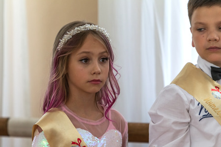 Odessa, Ukraine - May 31,2018: Children's musical group sing and dance on stage during graduation concert of elementary school. Children play. Emotional children's show on stage. Children's creativityのeditorial素材