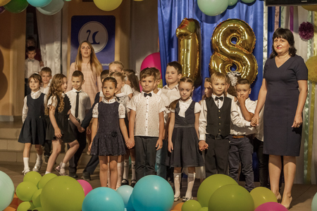 Odessa, Ukraine - May 31,2018: Children's musical group sing and dance on stage during graduation concert of elementary school. Children play. Emotional children's show on stage. Children's creativityのeditorial素材