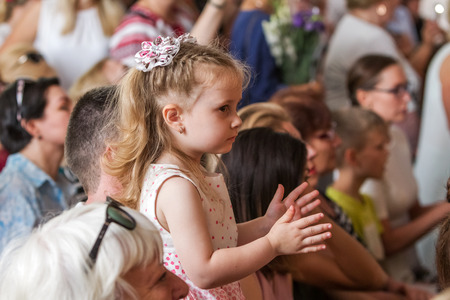 Odessa, Ukraine - May 31,2018: Children's musical group sing and dance on stage during graduation concert of elementary school. Children play. Emotional children's show on stage. Children's creativityのeditorial素材