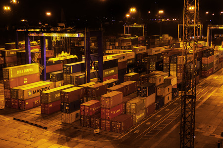 Odessa, Ukraine, Circus 2012: Sea commercial cargo port at night. Unloading, loading sea containers...