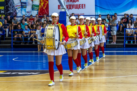 ODESSA, UKRAINE sept. 3,2017: Young beautiful athletic cheerleader girls with drums and pompoms entertain audience during break in basketball game. Ð¡heerleaders in beautiful uniform are performingのeditorial素材