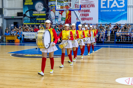 ODESSA, UKRAINE sept. 3,2017: Young beautiful athletic cheerleader girls with drums and pompoms entertain audience during break in basketball game. Ð¡heerleaders in beautiful uniform are performingのeditorial素材