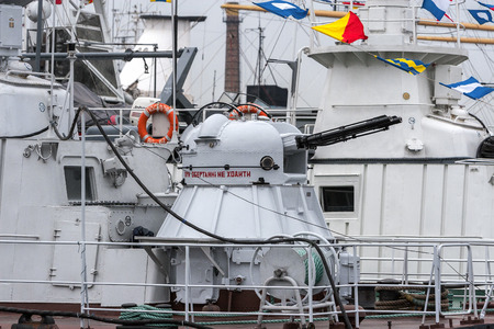 Odessa, Ukraine May 25, 2005: Barrel of a warship against the background of the blue sea. Navy, ship of the Ukrainian army. Cannon of a warshipのeditorial素材