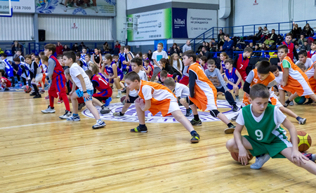 Odessa, Ukraine - December 23, 2018: young children play basketball, participate in children's sports competitions during celebration children's sports basketball club of children's sports schoolのeditorial素材