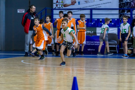 Odessa, Ukraine - December 23, 2018: young children play basketball, participate in children's sports competitions during celebration children's sports basketball club of children's sports schoolのeditorial素材