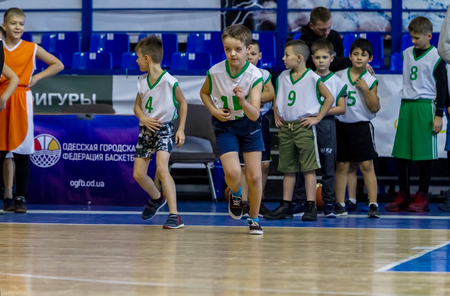 Odessa, Ukraine - December 23, 2018: young children play basketball, participate in children's sports competitions during celebration children's sports basketball club of children's sports schoolのeditorial素材