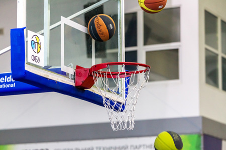 Odessa, Ukraine - December 23, 2018: basketball balls fly into the basketball basket during the...