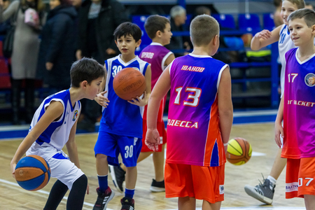 Odessa, Ukraine - December 23, 2018: young children play basketball, participate in children's sports competitions during celebration children's sports basketball club of children's sports schoolのeditorial素材