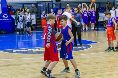Odessa, Ukraine - December 23, 2018: young children play basketball, participate in children's sports competitions during celebration of children's sports basketball club of children's sports schoolのeditorial素材
