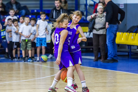 Odessa, Ukraine - December 23, 2018: young children play basketball, participate in children's sports competitions during celebration of children's sports basketball club of children's sports schoolのeditorial素材