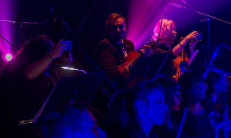 ODESSA, UKRAINE - JANUARY 24, 2019: Symphony orchestra concert on theater stage. Musicians of State Symphony Orchestra, instruments of symphony orchestra on stage. Score, sheet music during concert