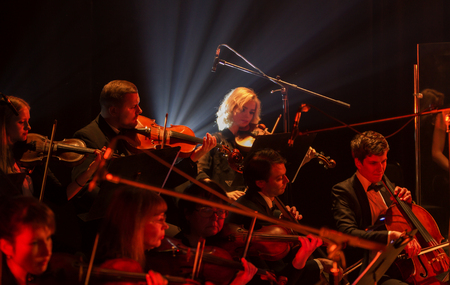 ODESSA, UKRAINE - JANUARY 24, 2019: Symphony orchestra concert on theater stage. Musicians of State Symphony Orchestra, instruments of symphony orchestra on stage. Score, sheet music during concertのeditorial素材