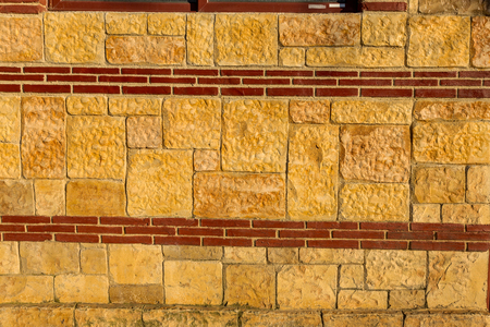 Modern stone wall. Decorative natural stone wall in the form of decorative interior decoration. Natural stone wall texture for background. Old brick texture, brick wall decor of natureの写真素材