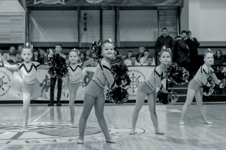 Odessa, Ukraine - Febr 16, 2019: Bright dynamic characteristics of a support group of women's sports team. Performance Support Group. Bright beautiful young girl in sports dance form on the playgroundのeditorial素材