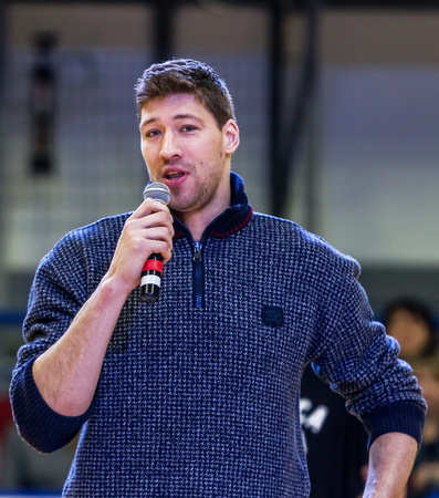 ODESSA, UKRAINE - February 16, 2019: Interview of captain of Ukrainian national basketball team Vyacheslav Kravtsov during opening of children's championship. Basketball player Vyacheslav Kravtsovのeditorial素材