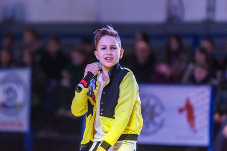 Odessa, Ukraine - February 16, 2019: Children's music groups singing and dancing on basketball court during a commercial break. Children's play. Emotional children's show on stage. Dancing on stageのeditorial素材