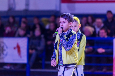 Odessa, Ukraine - February 16, 2019: Children's music groups singing and dancing on basketball court during a commercial break. Children's play. Emotional children's show on stage. Dancing on stageのeditorial素材
