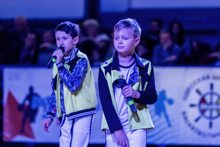 Odessa, Ukraine - February 16, 2019: Children's music groups singing and dancing on basketball court during a commercial break. Children's play. Emotional children's show on stage. Dancing on stageのeditorial素材