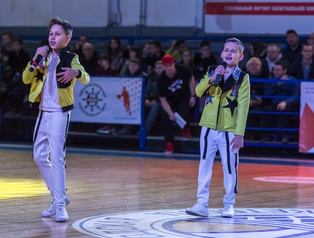 Odessa, Ukraine - February 16, 2019: Children's music groups singing and dancing on basketball court during a commercial break. Children's play. Emotional children's show on stage. Dancing on stageのeditorial素材