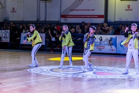 Odessa, Ukraine - February 16, 2019: Children's music groups singing and dancing on basketball court during a commercial break. Children's play. Emotional children's show on stage. Dancing on stageのeditorial素材